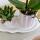 Kolibri Orchids Geschenkset Mediterranean Sunset Klein Grüne Pflanze mit Rosa Phalaenopsis Orchidee Andorra in Painted Stripe Zierpflanzentöpfen auf Weißem Organischen Tablett